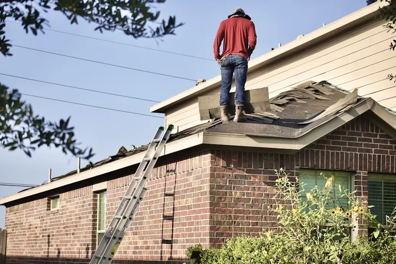 Professional roofer working on a residential roof in Suburbia